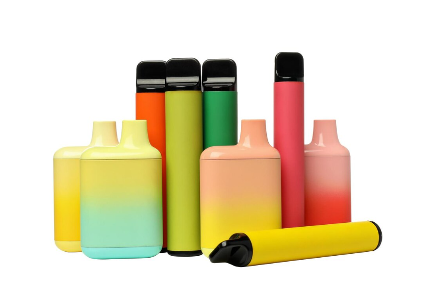 Various colorful disposable vape cartridges arranged together