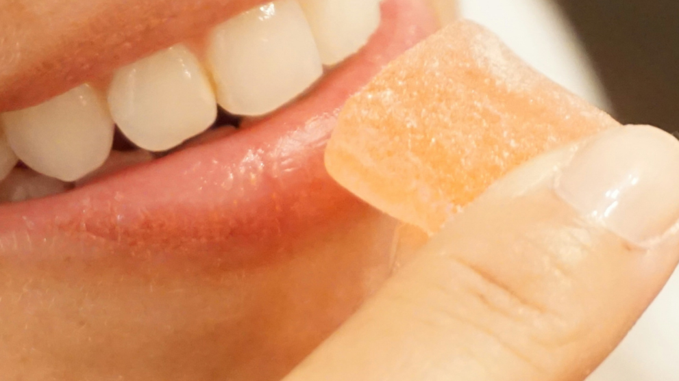 A Person Eating A THC Gummy