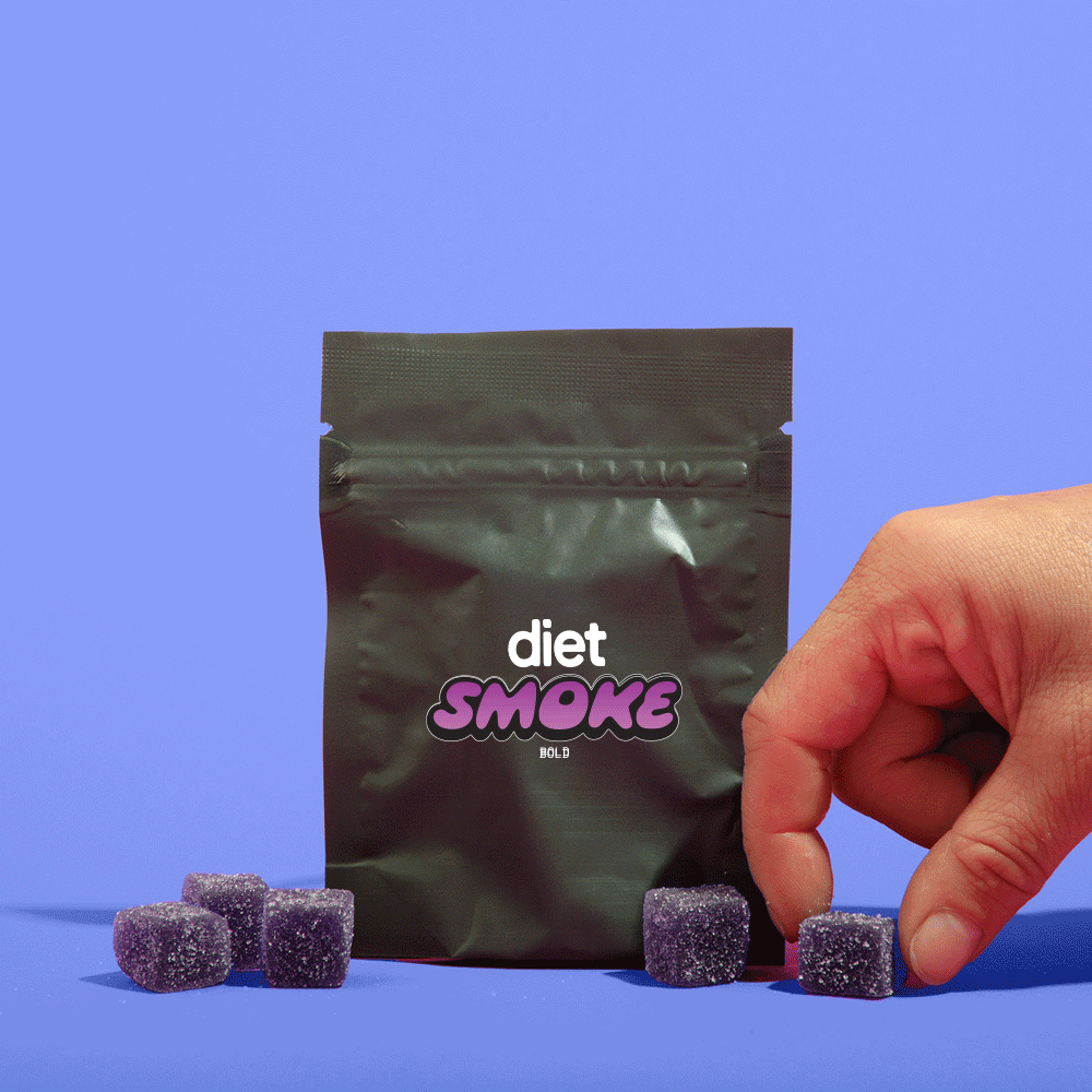A hand reaching for purple gummies from a Diet Smoke package against a blue background.