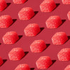 Red watermelon gummies arranged on a red background