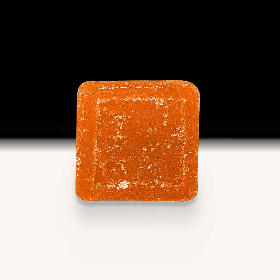 Square orange Peach CBD gummy on a white background